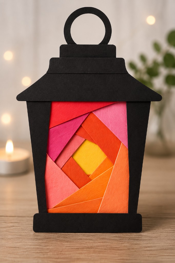 Finished black paper lantern iris folding craft with warm orange and pink folded paper